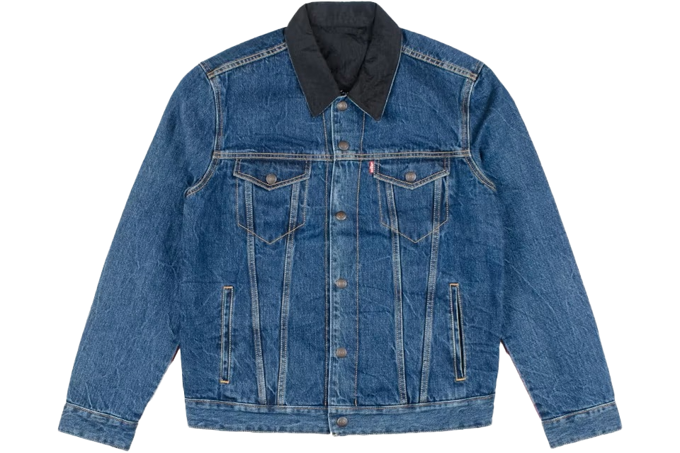 Blue denim levis jacket with black collar on a white background