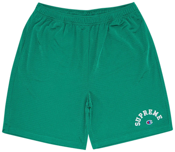 Green shorts with 'Supreme' and Champion logos on a white background