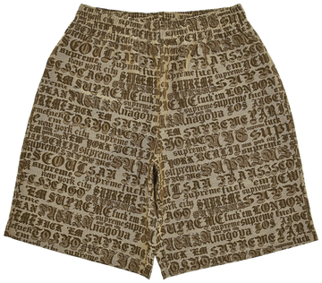 Beige shorts with black text pattern on a white background