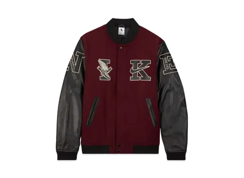 Maroon and black varsity jacket with embroidered letters on a white background
