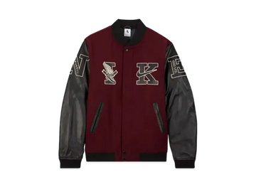 Maroon and black varsity jacket with embroidered letters on a white background