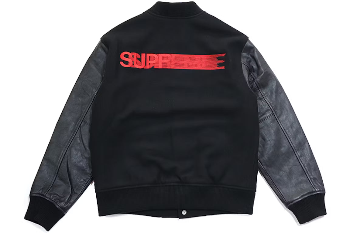 Black jacket with red 'Supreme' logo on the back against a white background